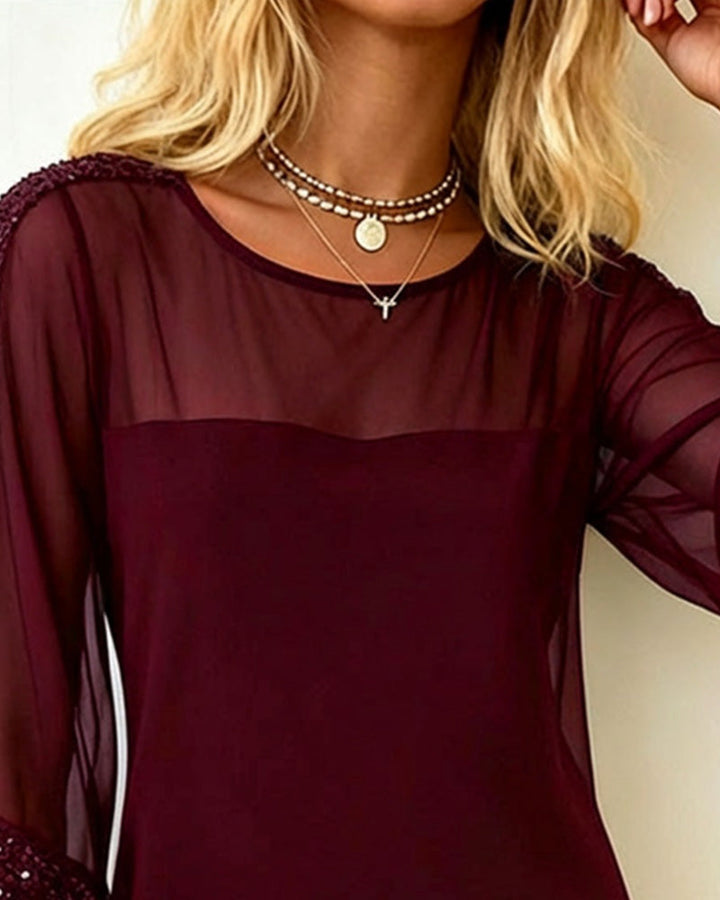 Abito con paillettes e inserti in mesh con scollo rotondo