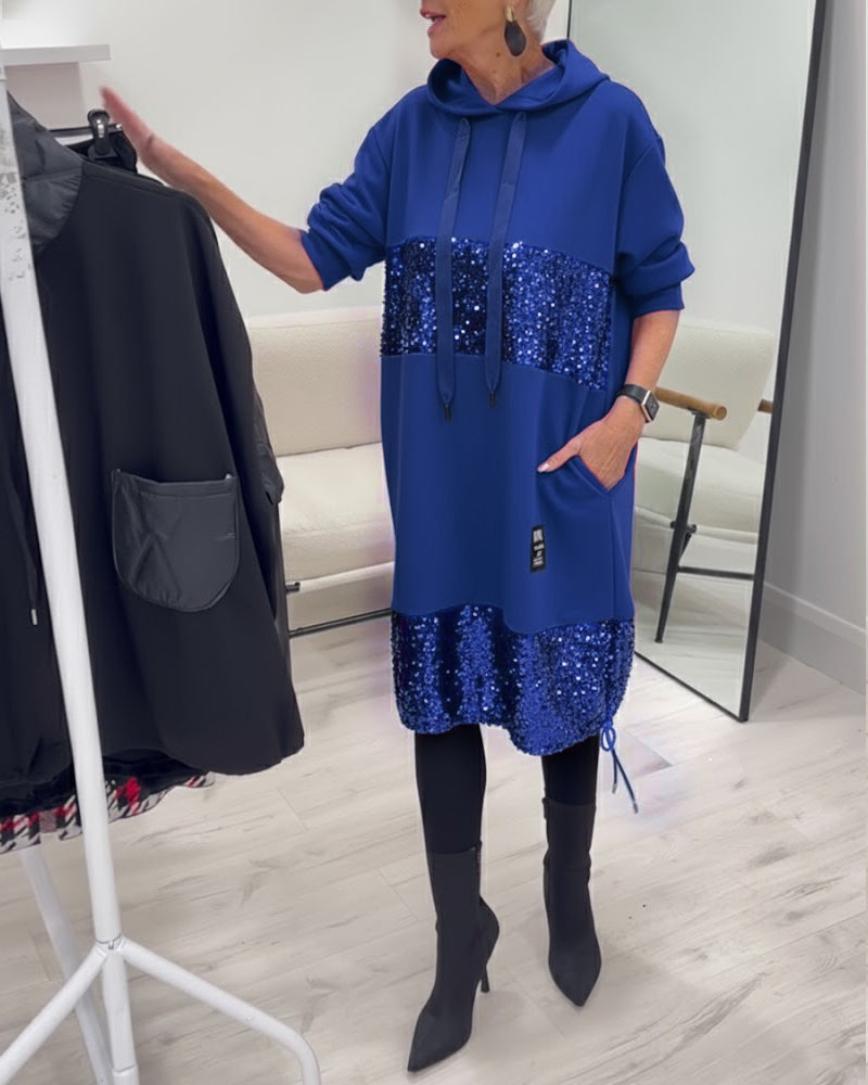 Benvenuti all'abito con cappuccio e patchwork di tendenza