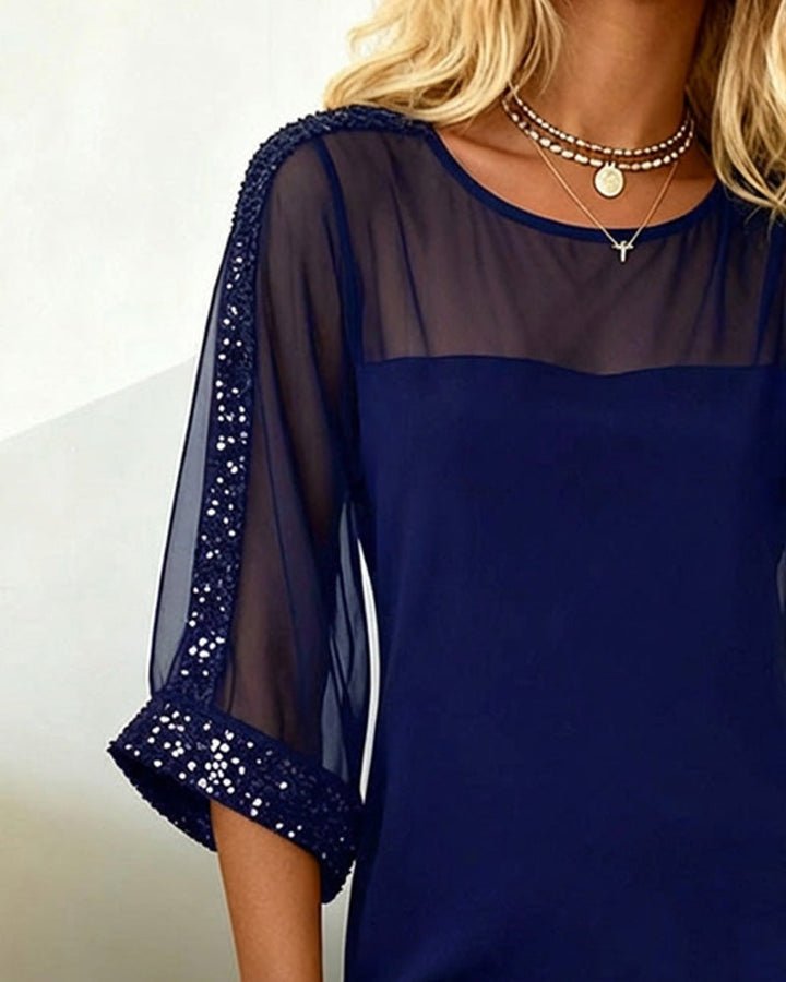 Abito con paillettes e inserti in mesh con scollo rotondo