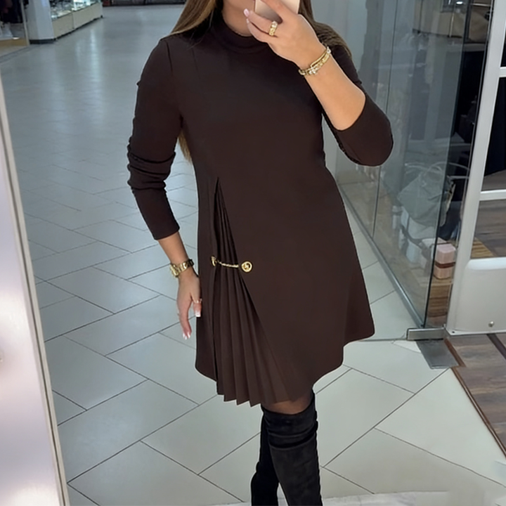 Elegant long-sleeved dress with pleated panels